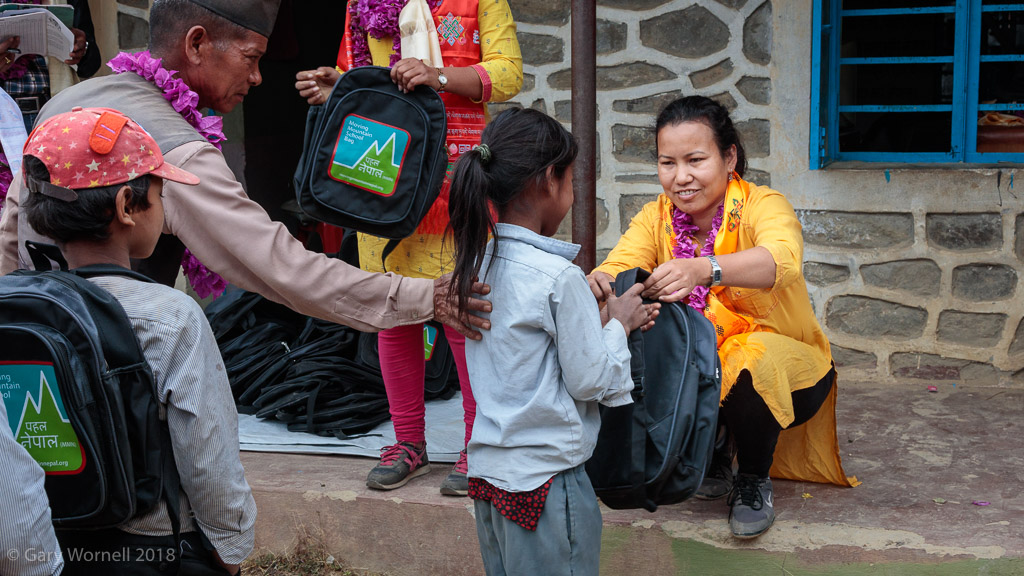 As each child's name is called out they come to the front of the line to receive their bag. 