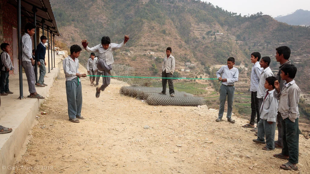Boys jump the rope during their lunch break at Shree Jwala Devi secondary school in Khavre.