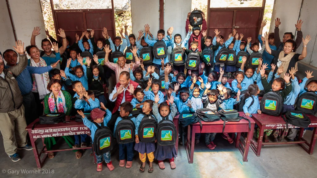 Children from Shree Tarevire Primary School gather for the group photo in their new classroom.
