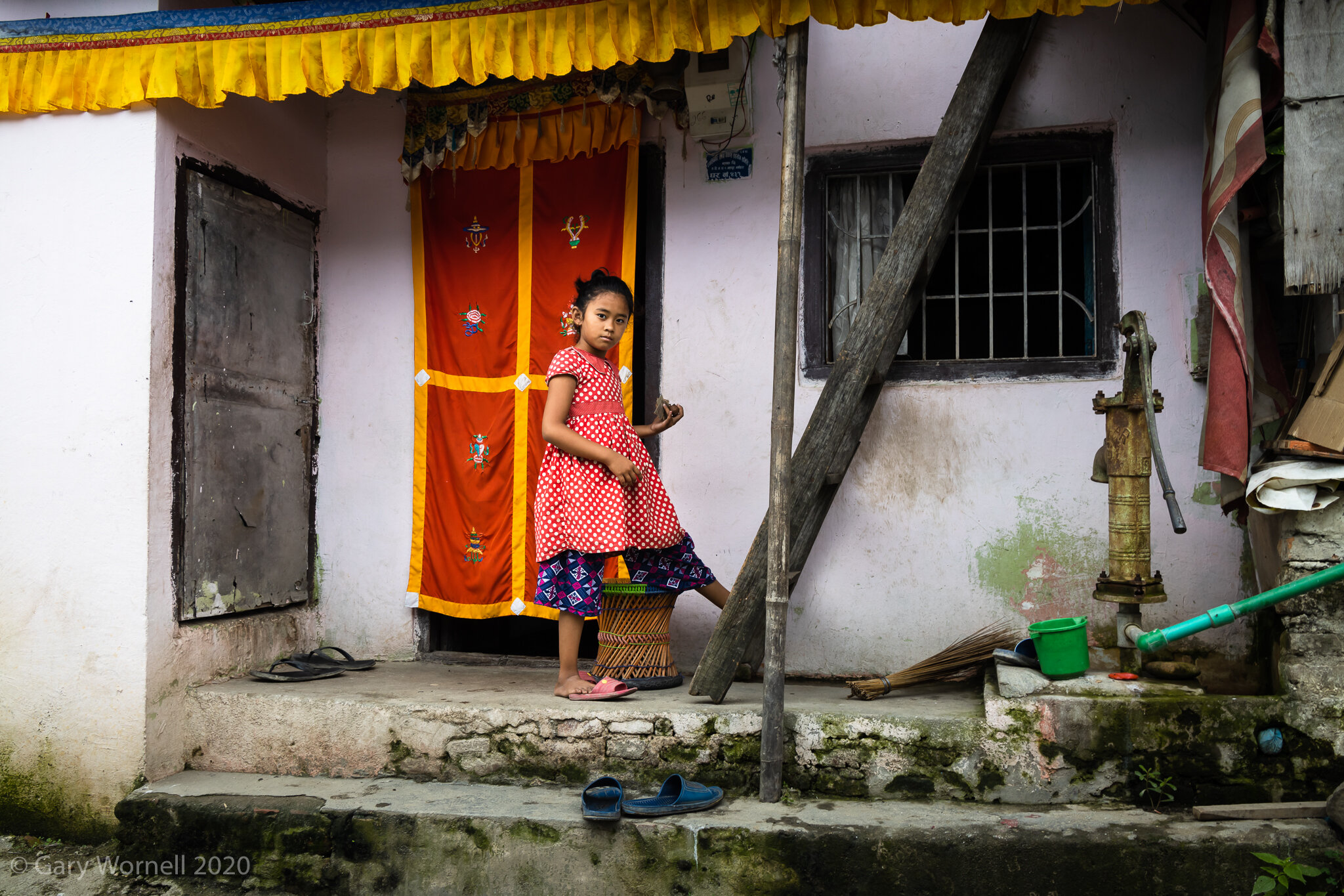  Young girl at the entrance of her home in Manohara, Kathmandu. 