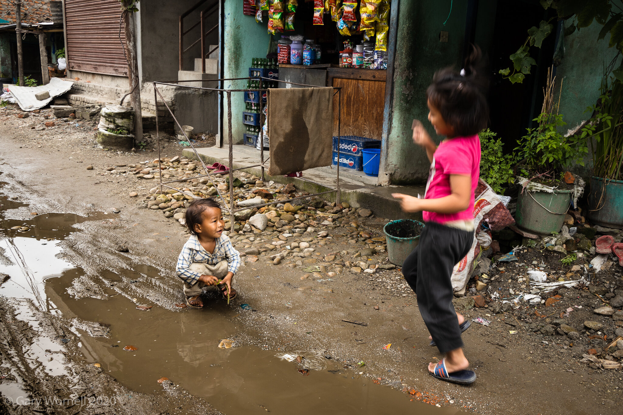  Children at play in the slum area of Manohara, Kathmandu. 