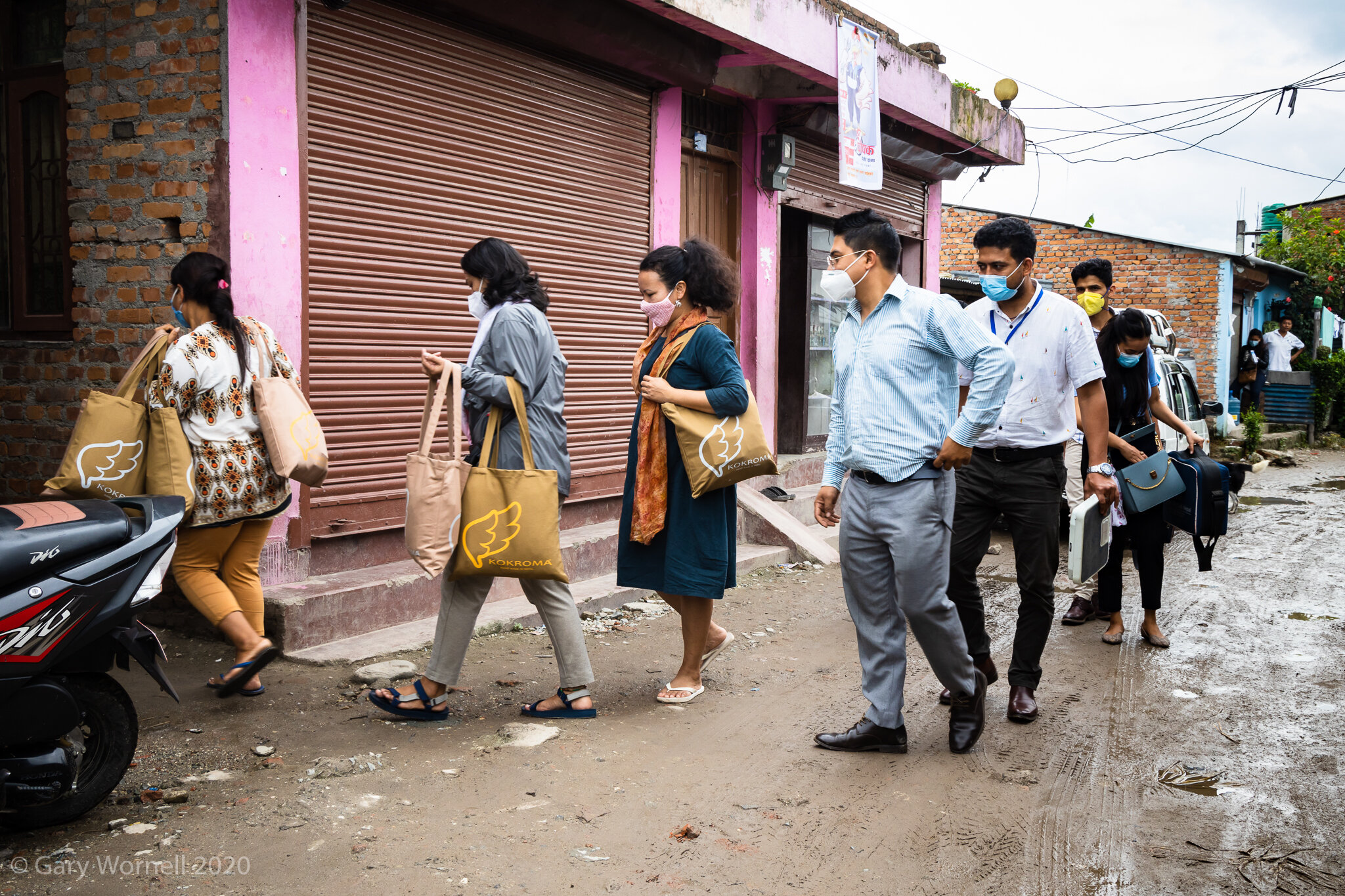 Rewati Gurung and members of Doctors on Call going to a comminity building in the slums of Manohara, Kathmandu. 