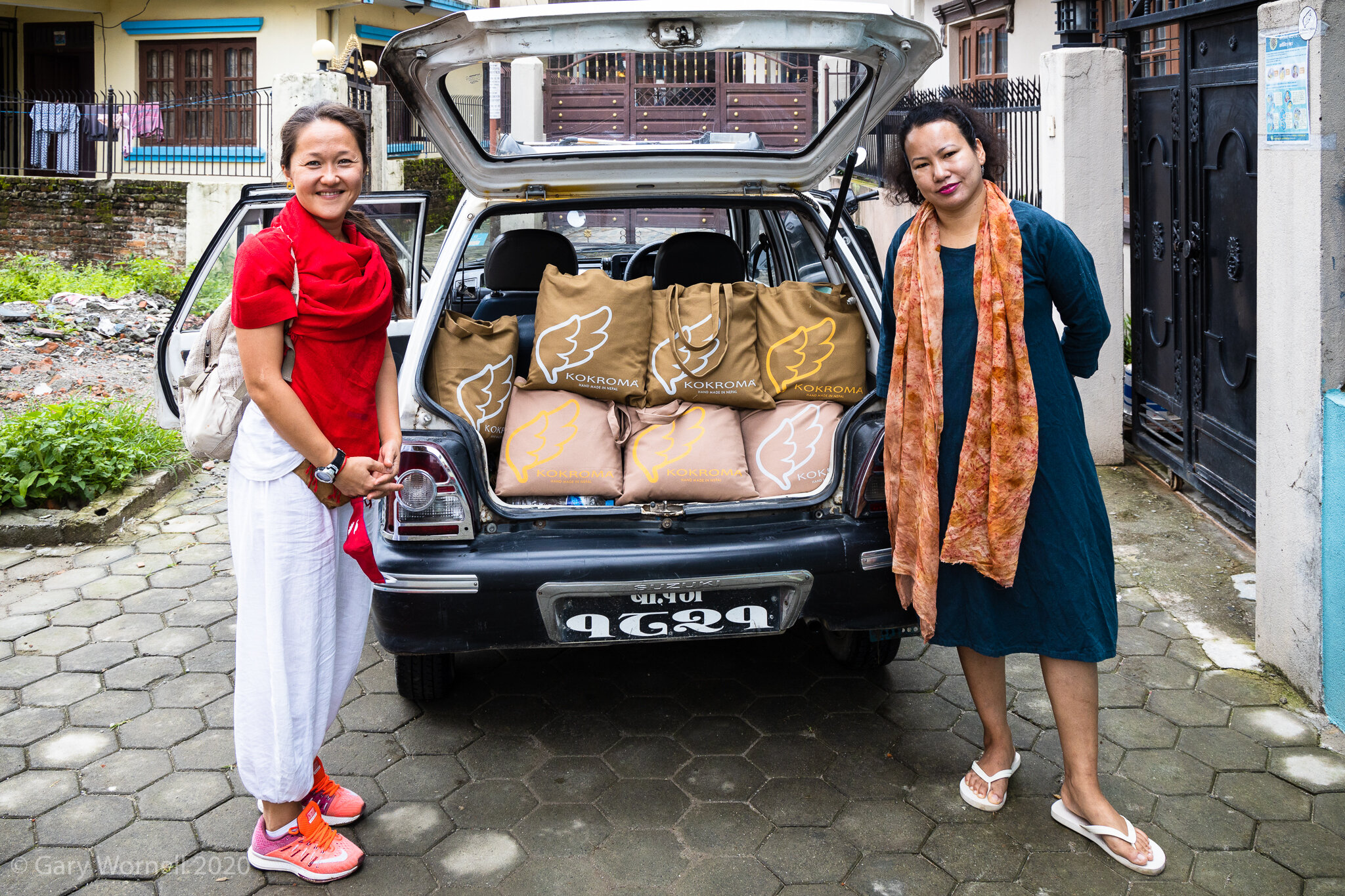  Rewati Gurung from Kokroma accompanied by volunteer Maria Bespalchinko from Russia prepare to leave for a Cradle Care donation. 