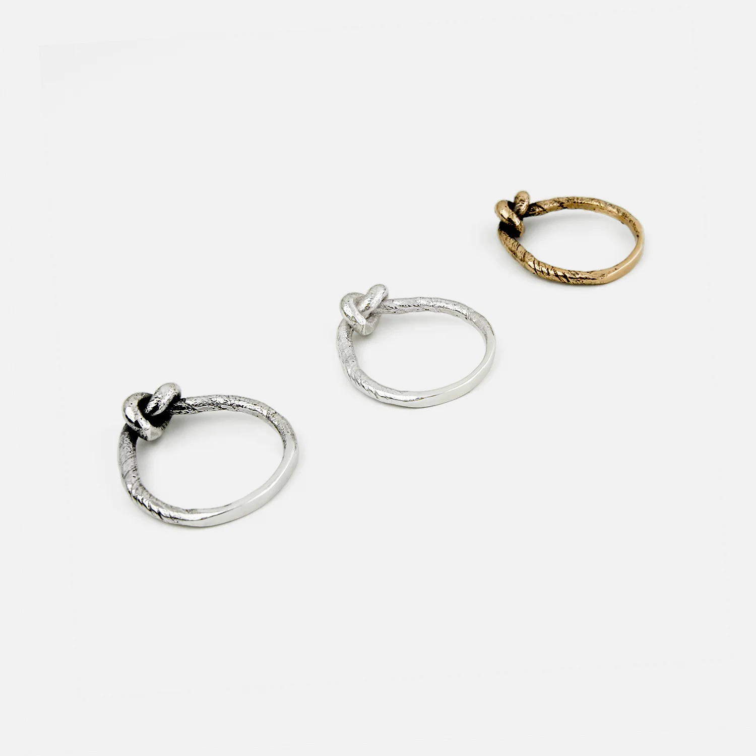 knot rings signed