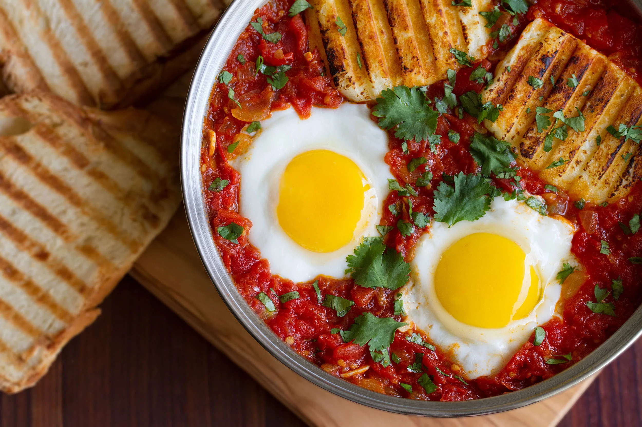 Spicy Baked Eggs with Halloumi & Harissa — Cooking with Cocktail Rings