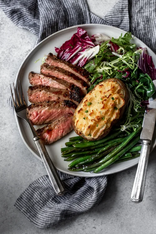 Cheesy+Cheddar+Twice+Baked+Potatoes+recipe+with+seared+steak+from+cooking+with+cocktail+rings?format=500w