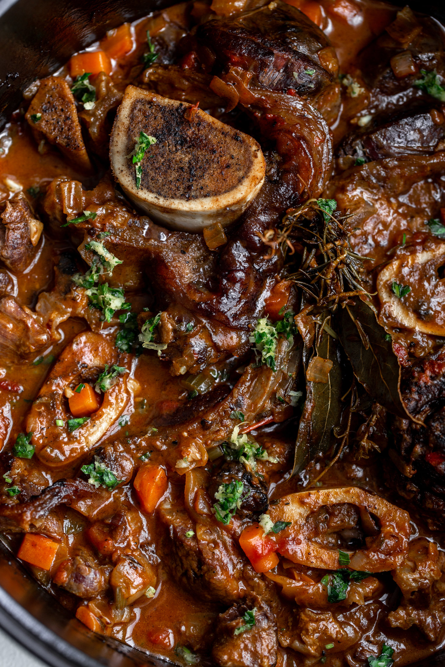 osso buco with gremolata and herbs braised in pot