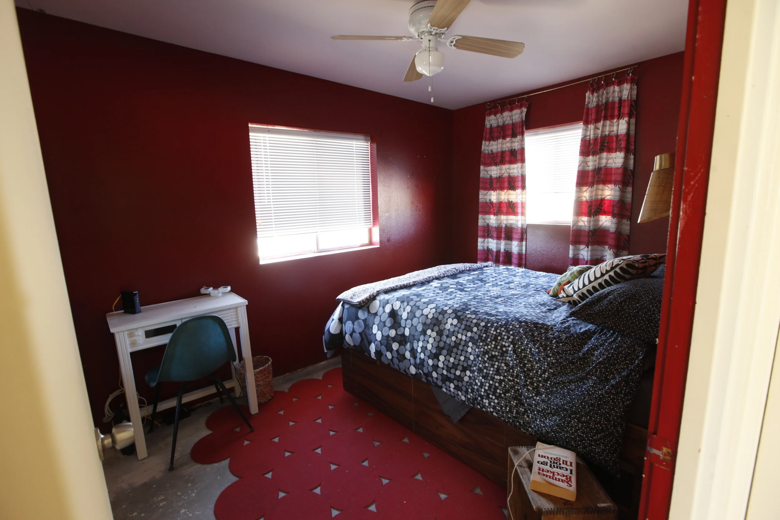 Red Bedroom, custom walnut bed with storage drawers by Kevin Greene