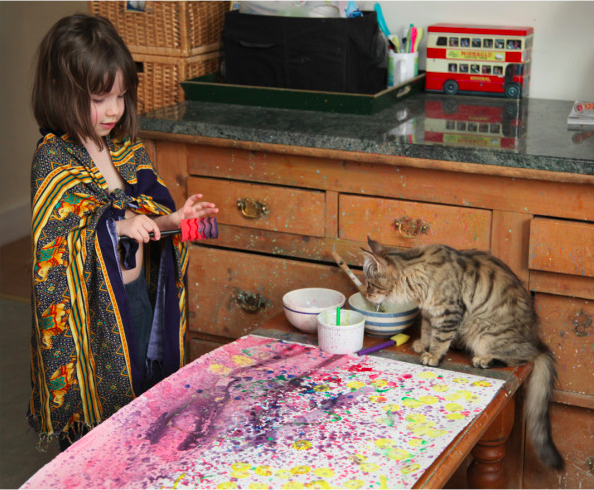Iris Grace painting with her cat