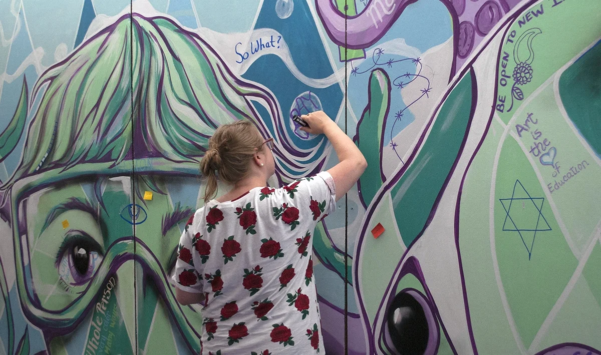 Everyone was invited to reflect on their experience and add to a colorful collaborative mural.