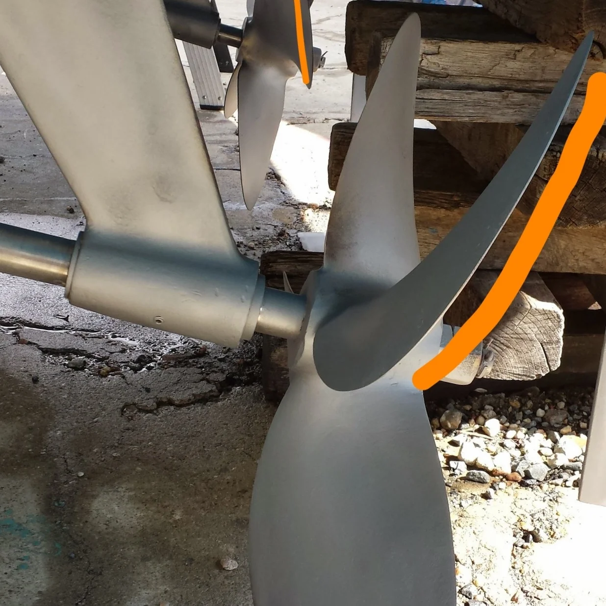 You can see the different angles of the blades on these angled shafts. The blade in the background is nearly vertical while the blade in the foreground is quite aggressive. The propellers on this boat are set in opposite rotational directions to help cancel out any prop walk.