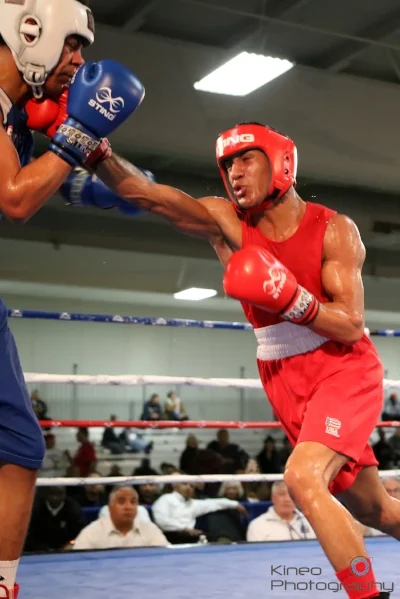 Portland Boxing Club’s Josniel Castro (right/red trunks), of Portland, and Marcus Davidson, of Kansas City, KS. Photo courtesy of Kineo Photography.