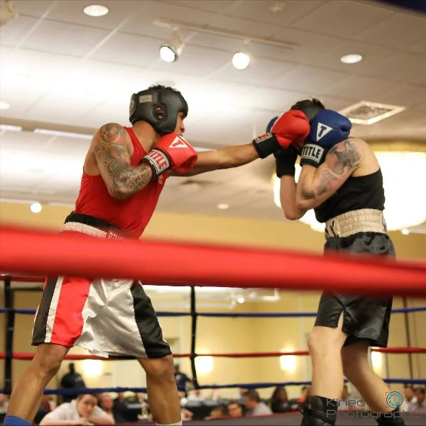 Portland Boxing Club’s Josniel Castro, left, and West Point's Luca Botis, right, at the Lawrence Exchange Club Charity Fight Night on April 20, 2019. Castro won by a 4-1 majority decision and was also awarded the "Outstanding Boxer of the Night" award. Photo courtesy Kineo Photography.