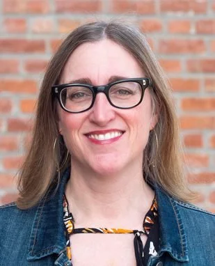 A plain light-colored background with the text 'COMING SOON' in bold blue letters in the center.