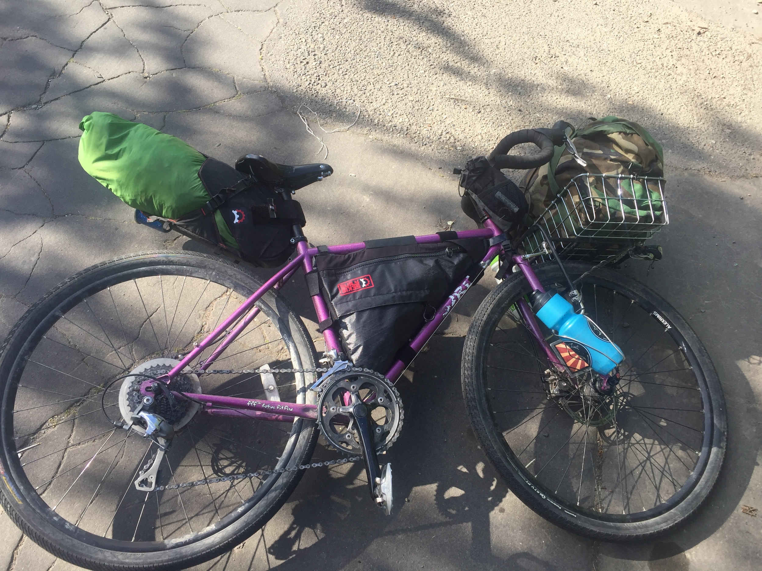 Here's my ready-to-go bike. You can see I moved the water bottle cages to the front fork and mounted them with electrical tape. 3 weeks later, they're still there. A+