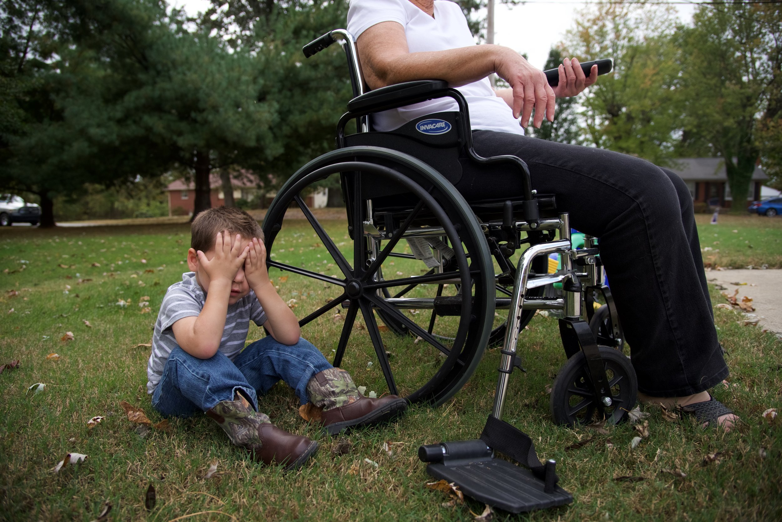  Bentley Francis, 3, sulks at the feet of his great-grandmother Jean Thetford, 78. &nbsp;The wheelchair is more of chair for Thetford who only uses it when she needs a place to sit outside. Keeping up with a 3-year-old at her age can be difficult but