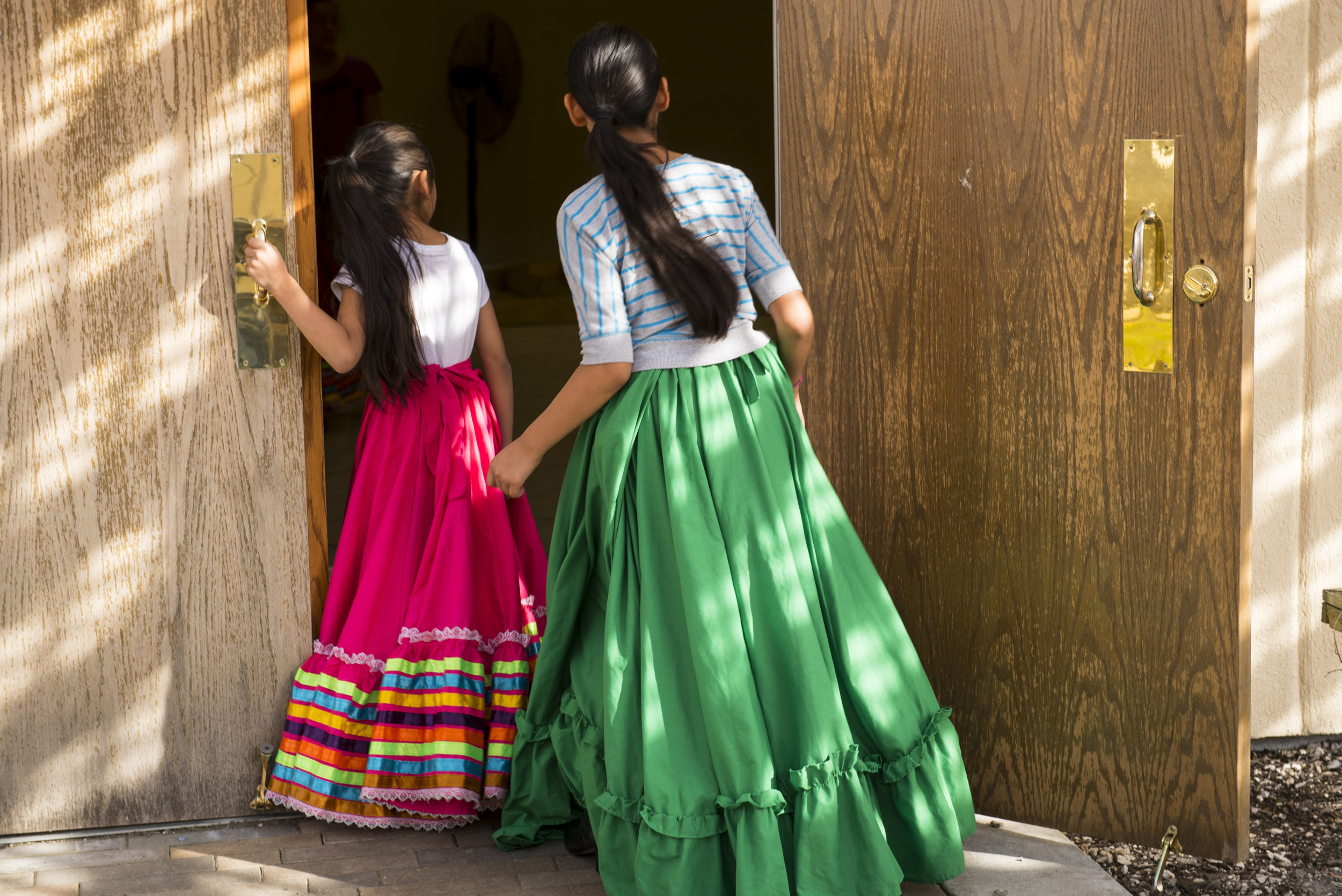  Dancers waiting for their turn to rehearse, watch another group practice in the building next to the taquería.      