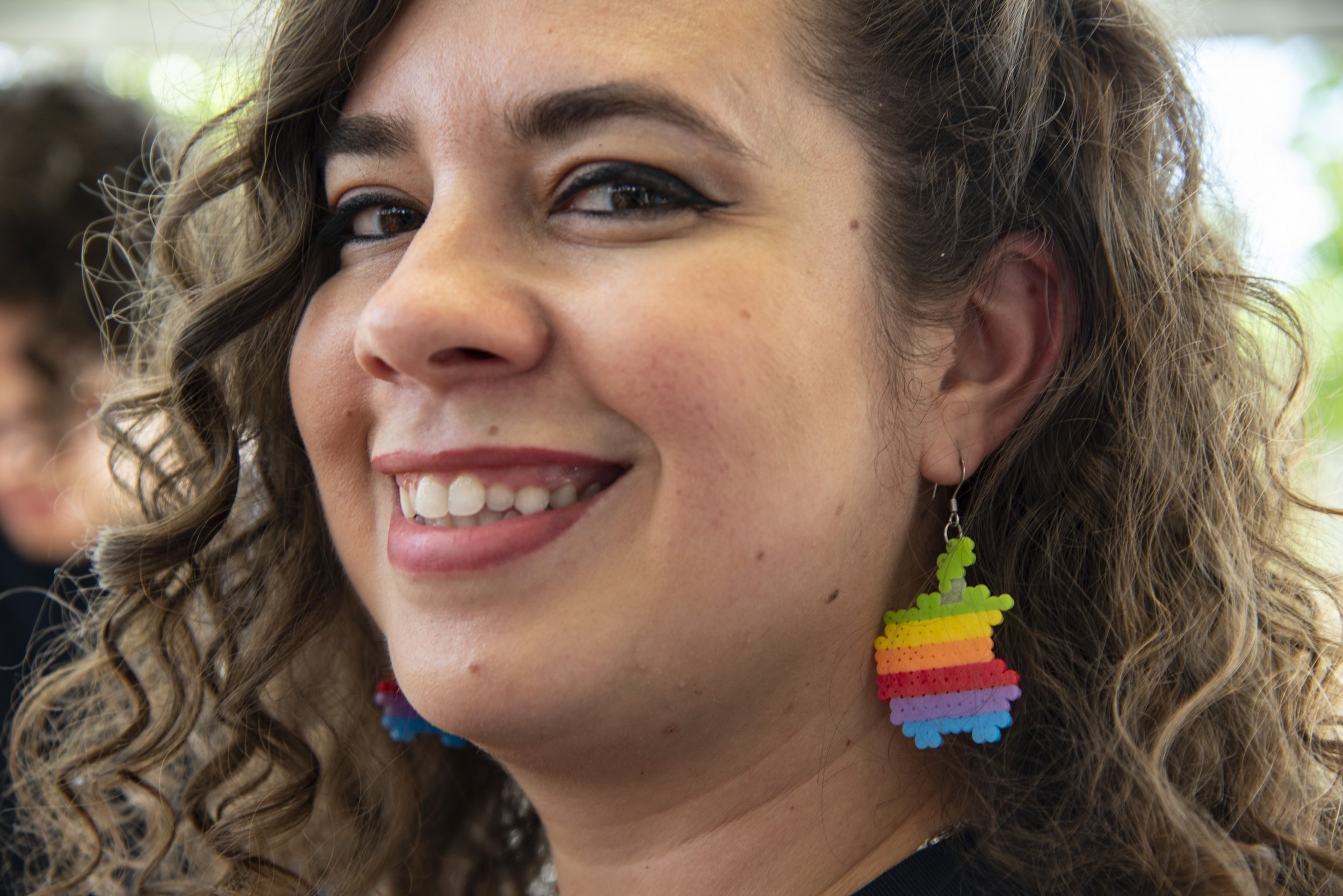  Apple Genuis, Lilly Etgar, 35, sports earrings mimicing Rob Janoff’s rainbow Apple design for opening day at the new Apple store in Aventura Mall on August 10, 2019. 