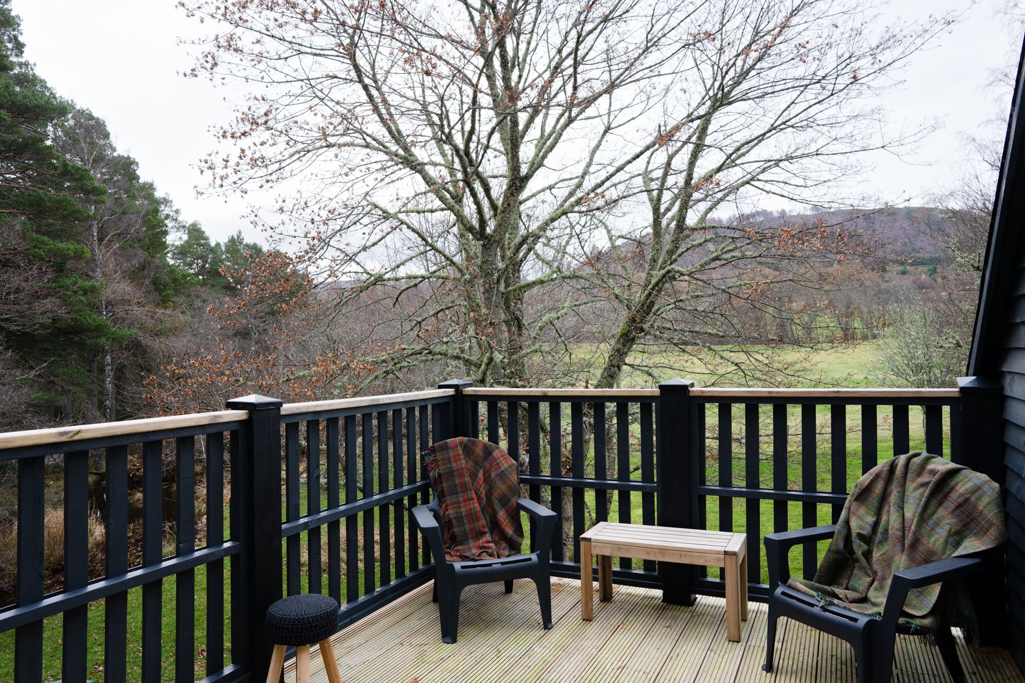 View from The Hayloft deck across the peaceful wooded surroundings at Rothiemurchus in the Cairngorms.