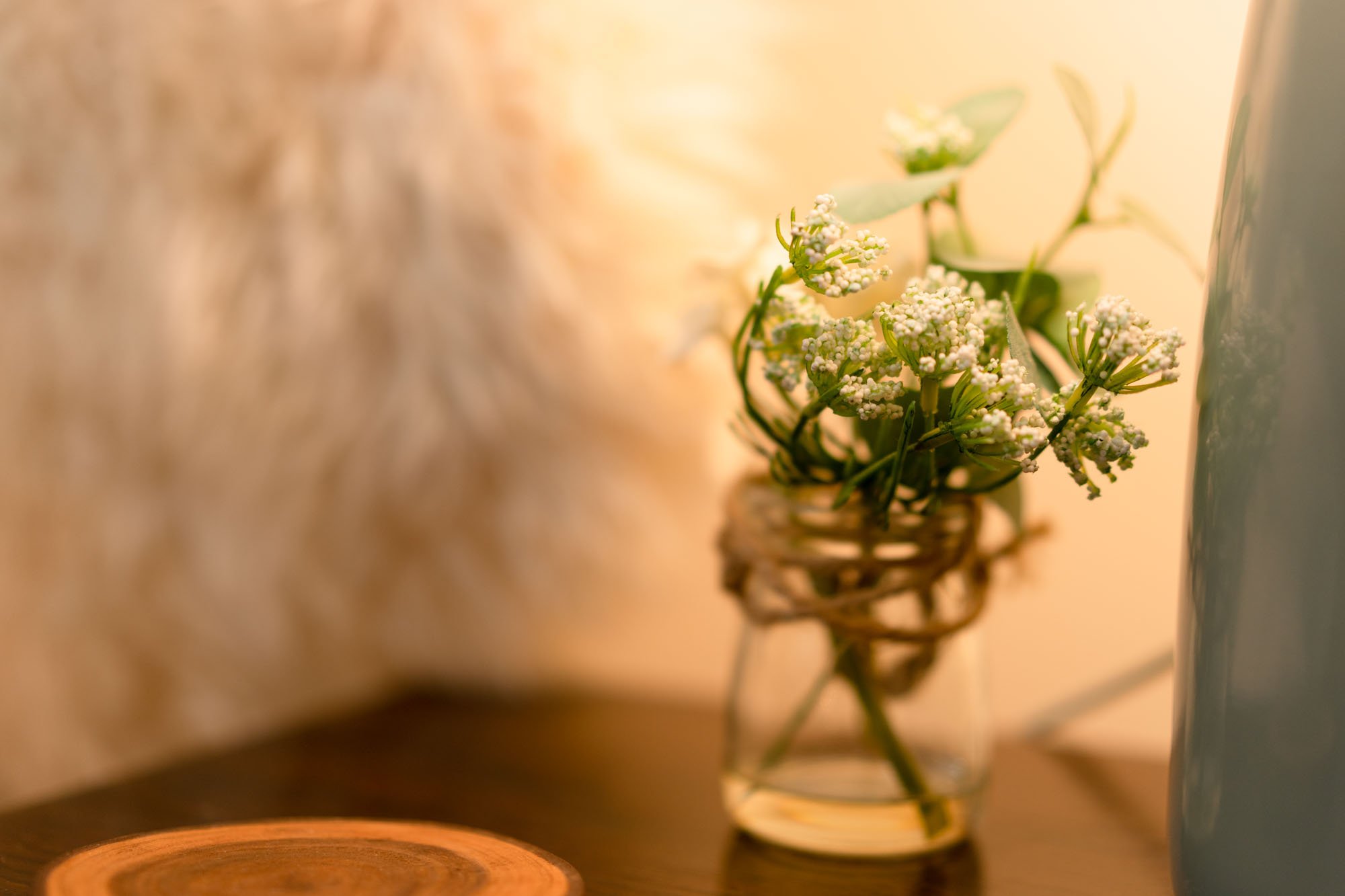Small vase of flowers and natural details inside The Hayloft holiday cottage.