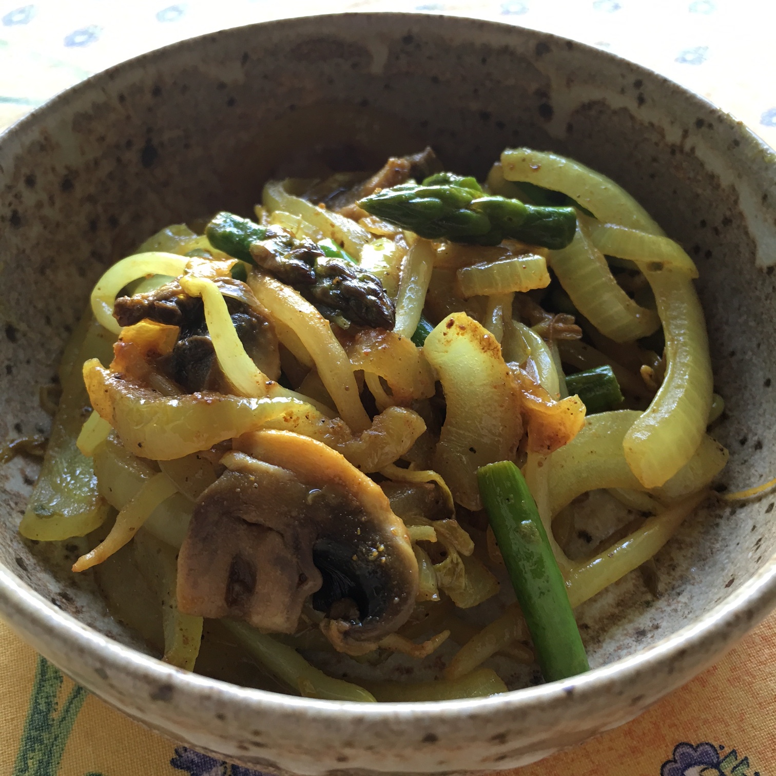    a close-up view of sautéed Asian Fusion veggies in a pretty pottery bowl...   
