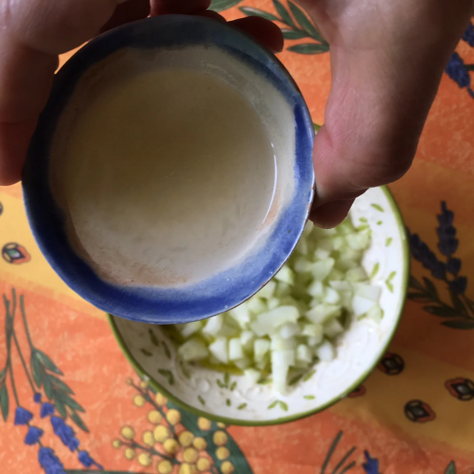    adding lemon juice to the yogurt and cucumber bowl...   