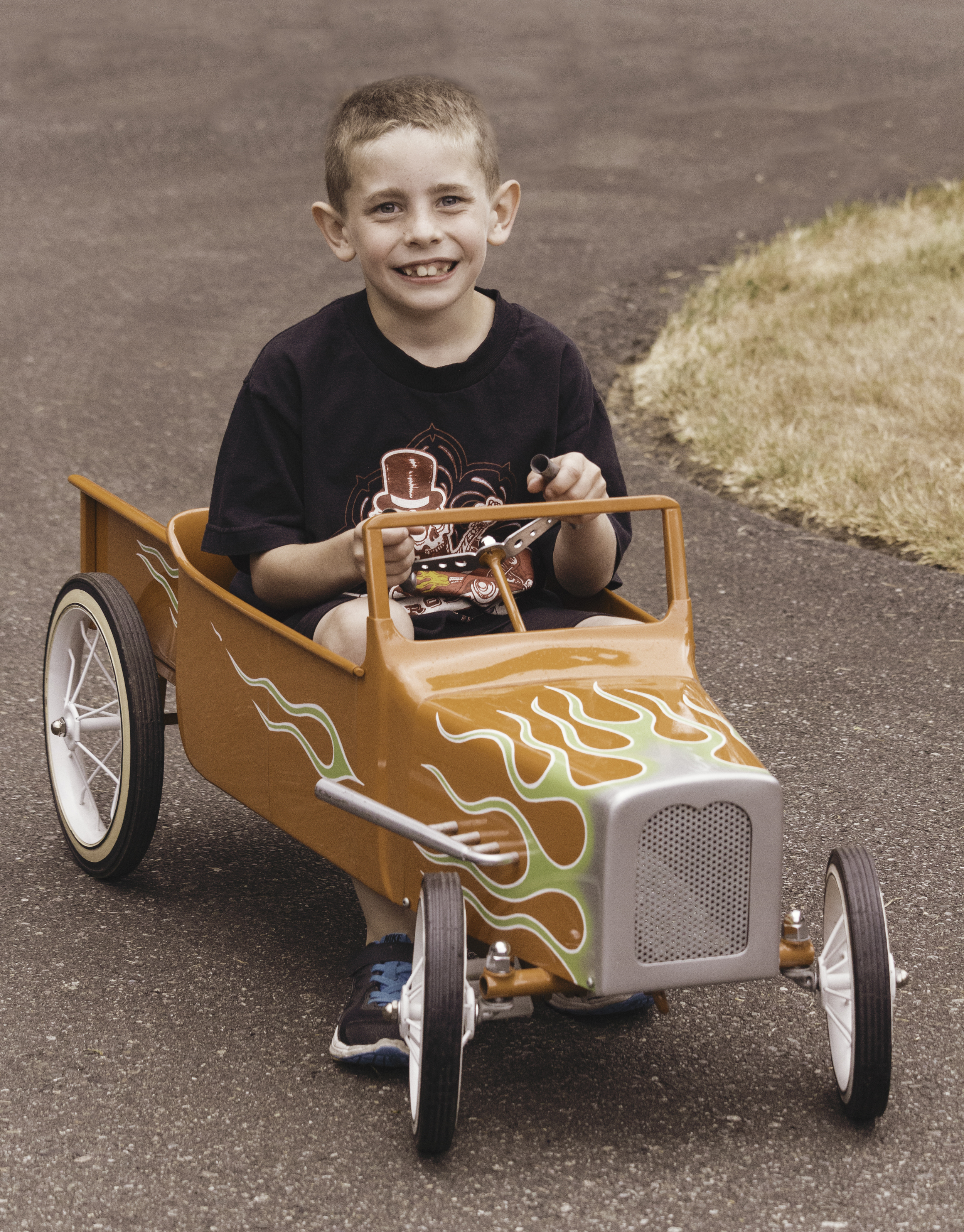 Kid in Peddle Car.jpg
