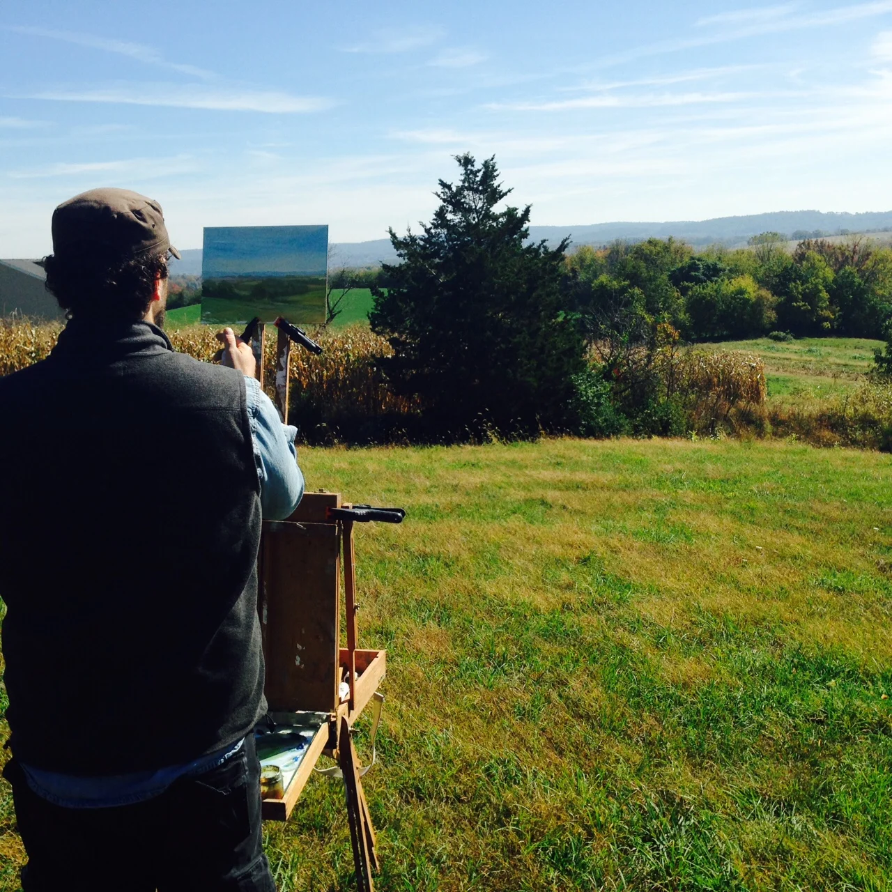 Adriano, painting the distant hills from our perch on top of the world at Clear Spring Farm.