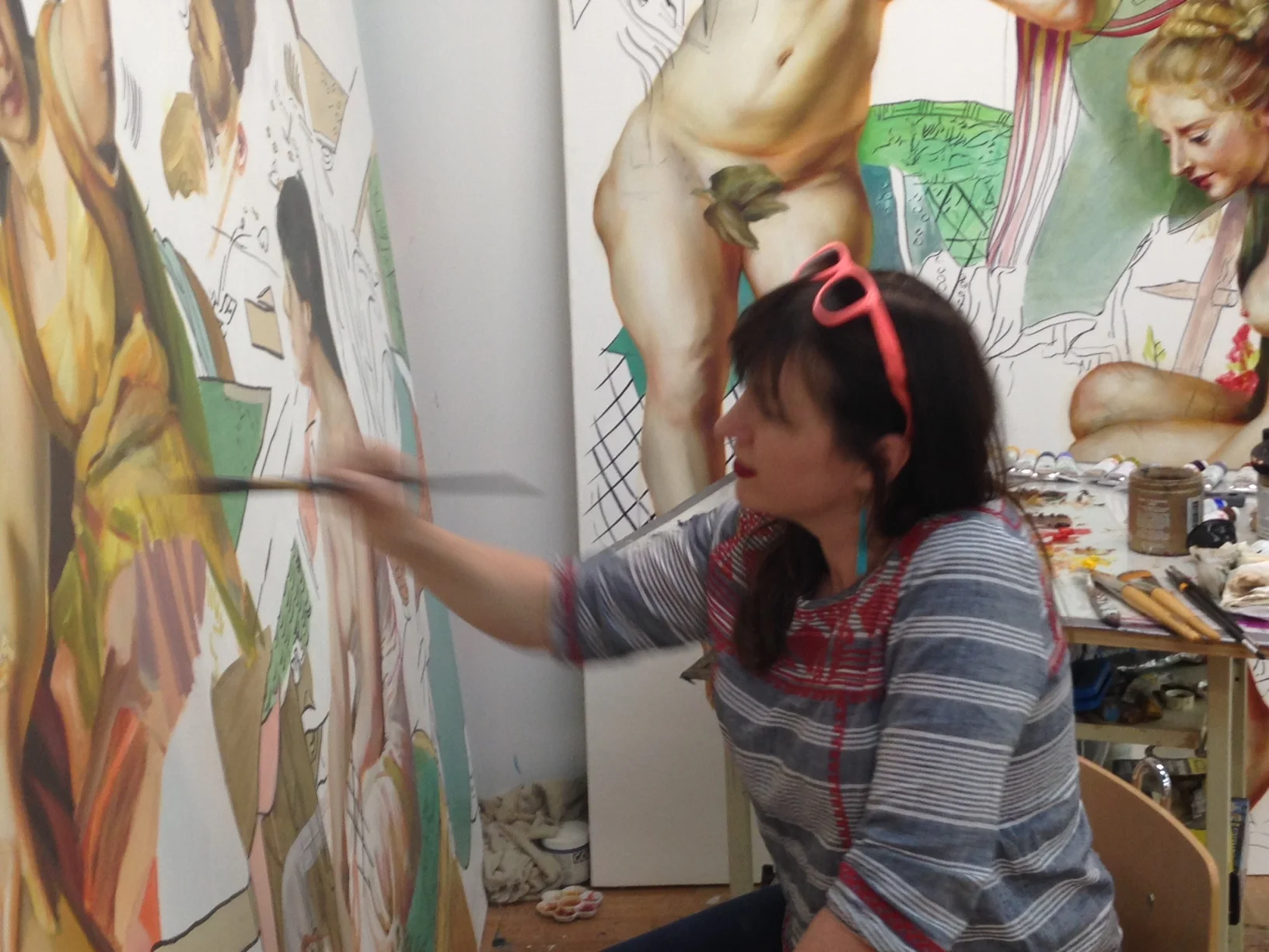 Angie painting in her studio. I know it's a little blurry, but I just love the paintbrush-in-action!