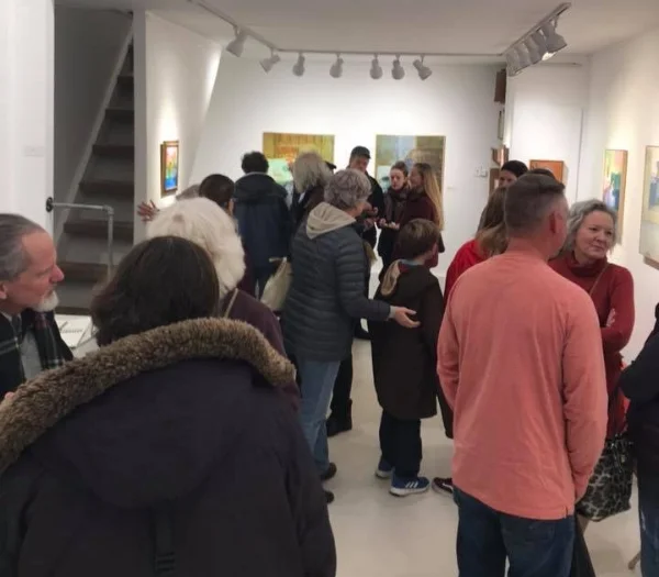 In this photo, the artist Ellen Sapienza is all the way on the far right, wearing red.