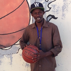Alhagie Manjang holding a basketball