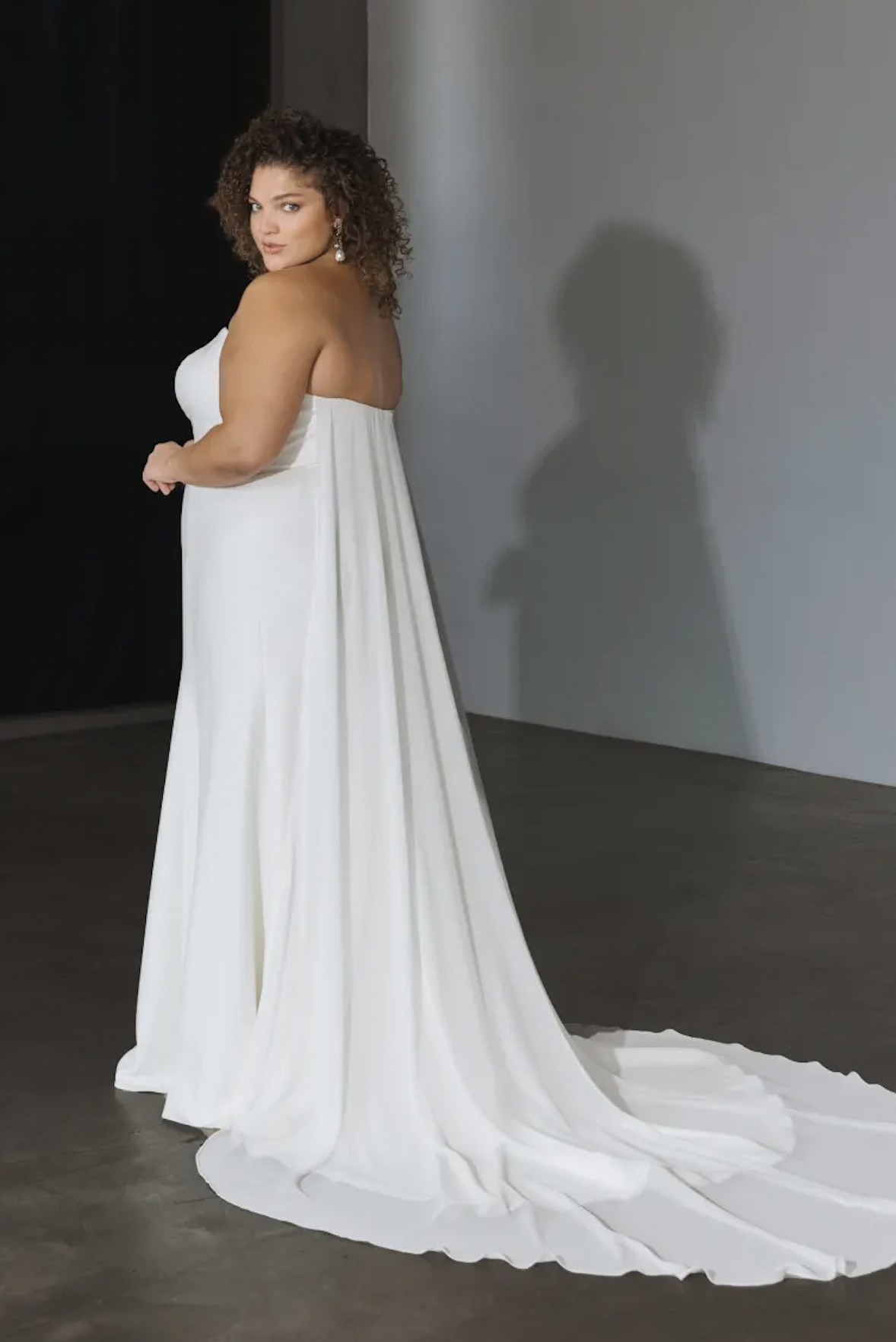 woman wearing Jenny Yoo Bennett strapless sheath wedding dress
