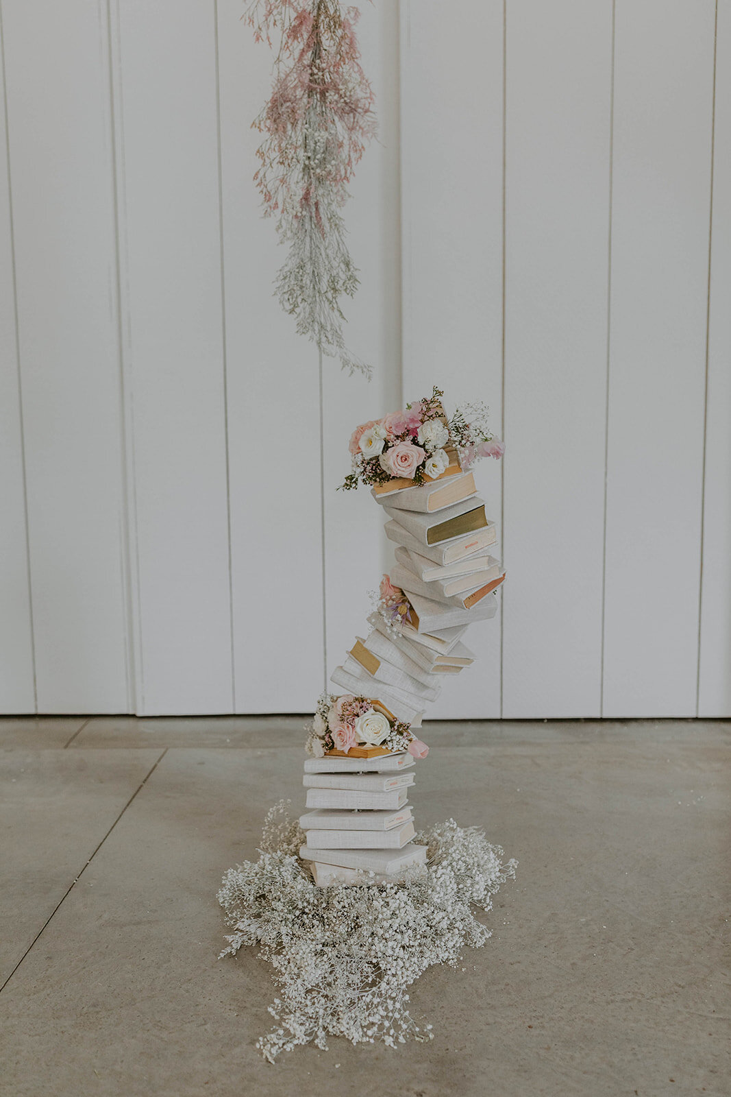 Colorful floral and book arch.