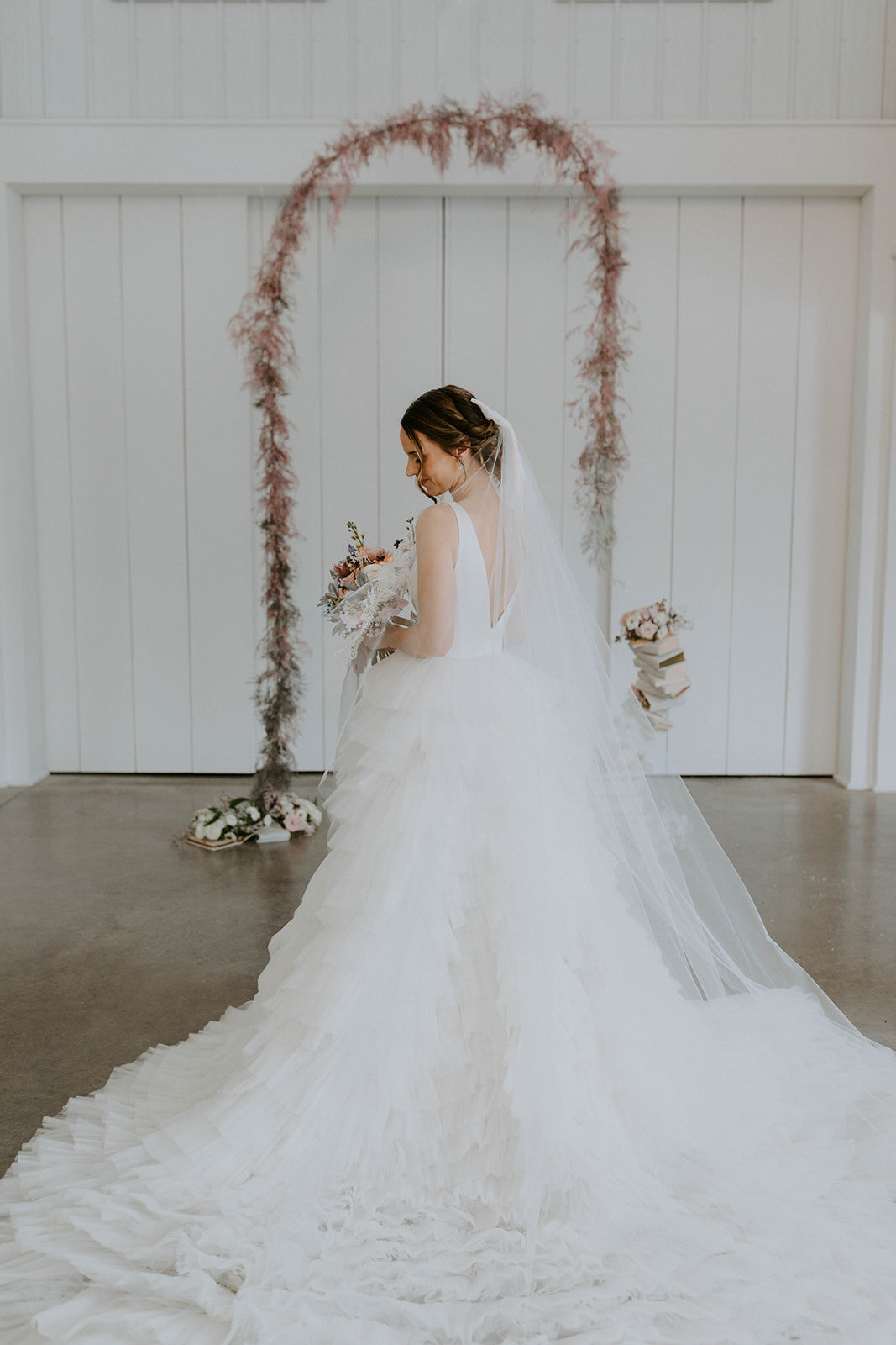 Romantic wedding styled shoot at Cliffside Acres. Bride is wearing Ross by Rivini, a textured ball gown wedding dress.