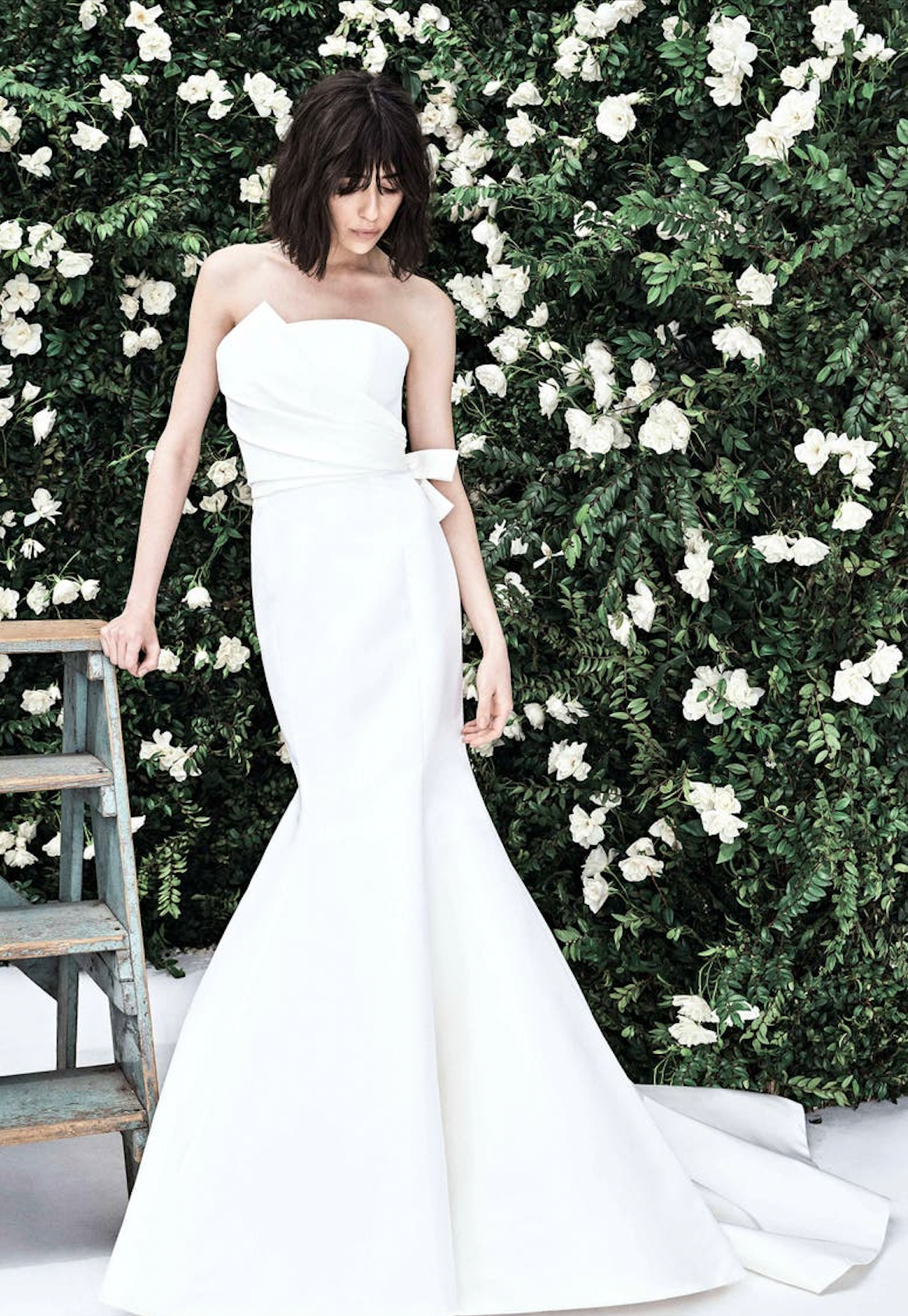 Classic & fitted Carolina Herrera strapless wedding dress.