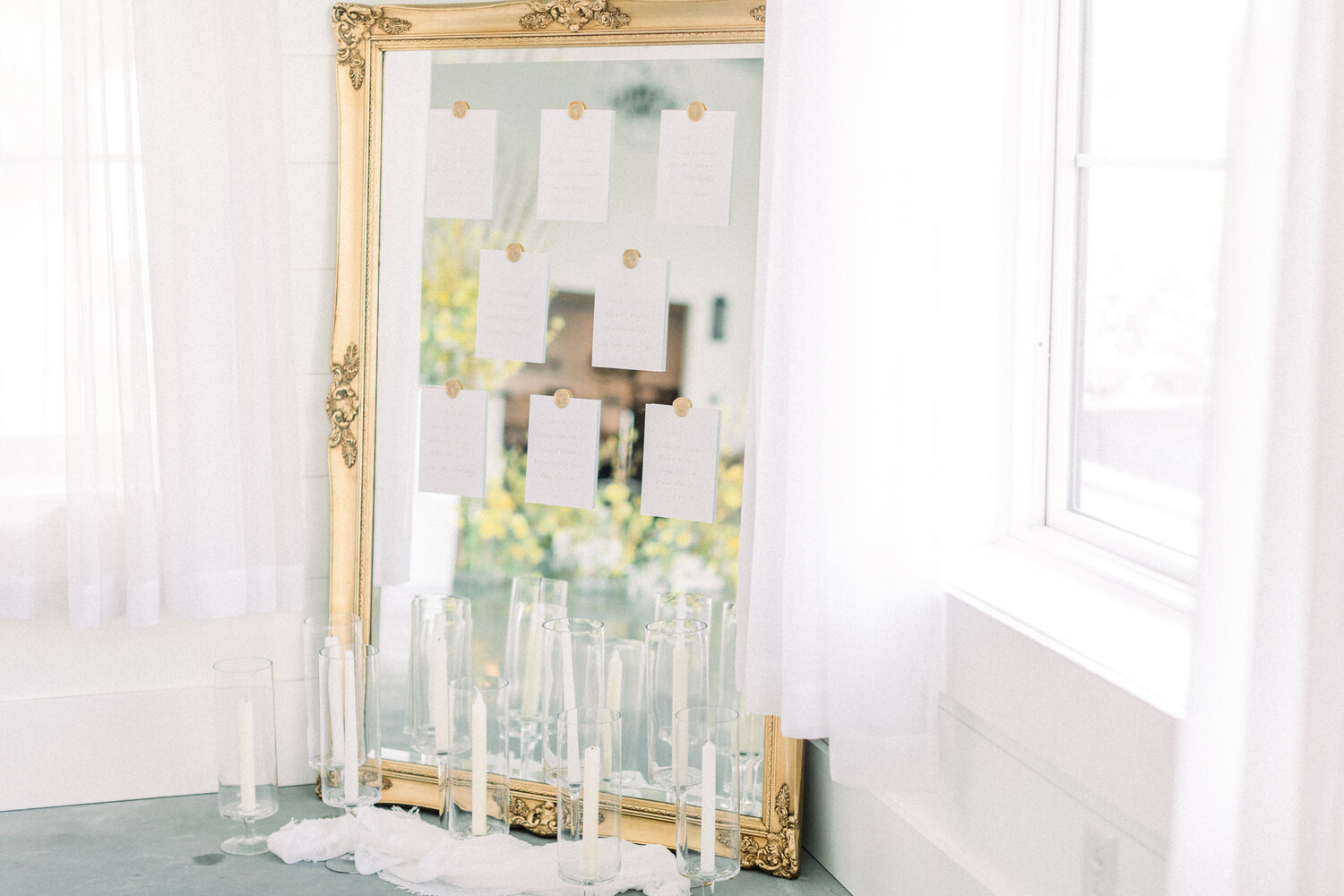 Summer wedding inspiration. Wedding table setting cards placed on mirror.