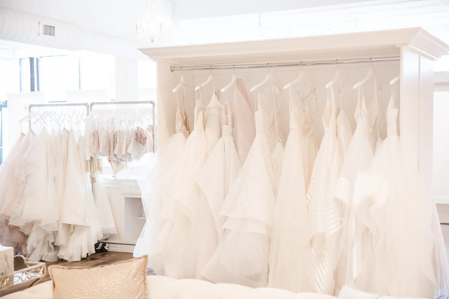Wedding dresses hanging at La Jeune Mariee Bridal Boutique in Columbus Ohio.