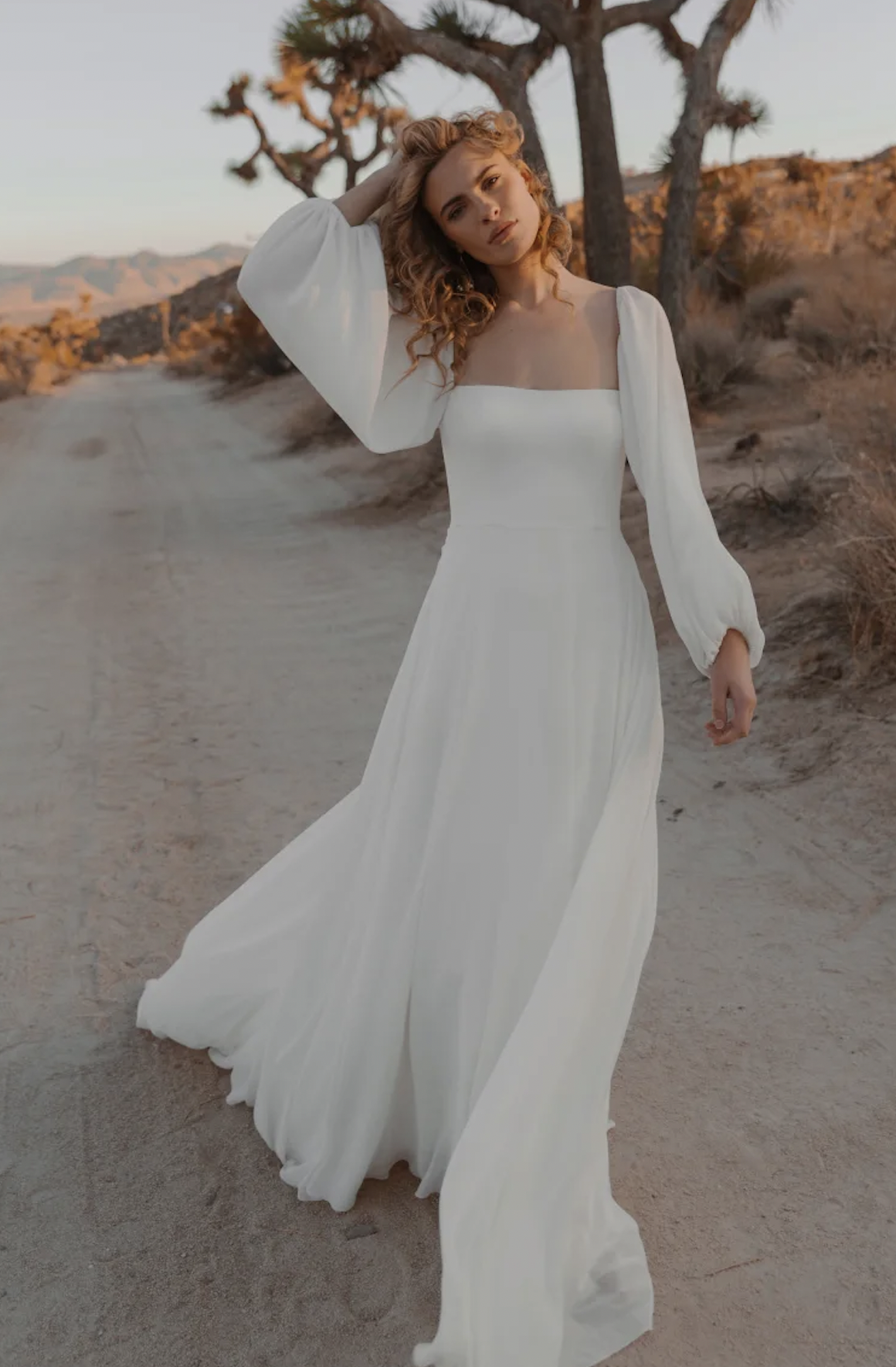 Model wearing Jenny Yoo Louise long sleeve a-line wedding dress.