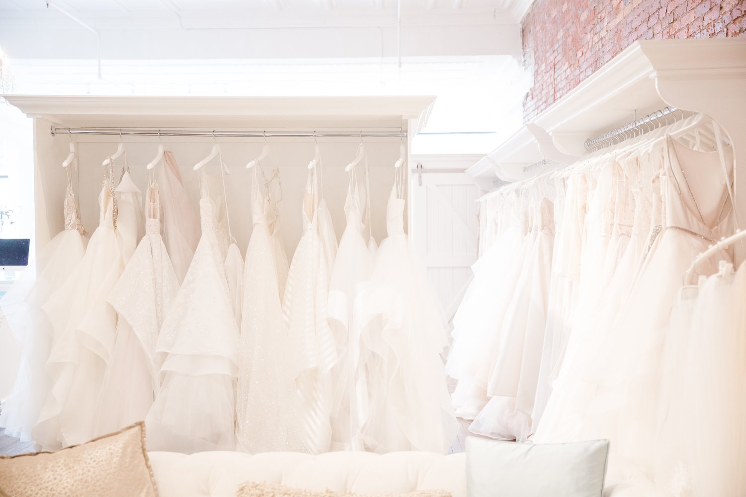 Wedding dress hanging at La Jeune Mariee Bridal Boutique.