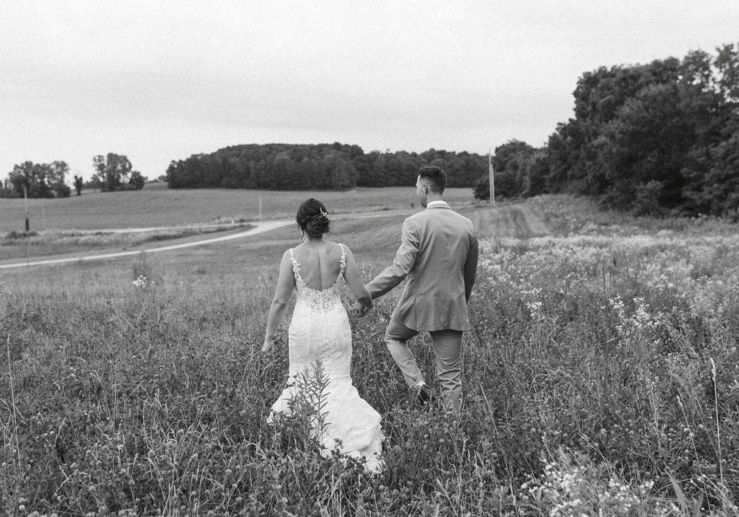 bride and groom posing for wedding portraits