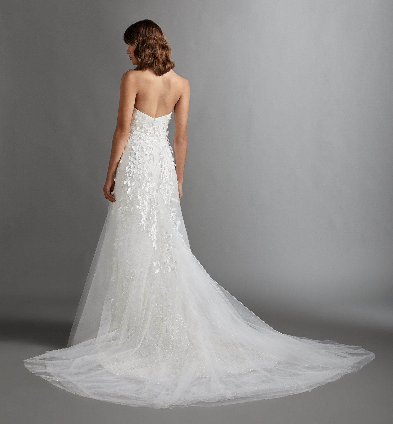 woman wearing Lazaro Clea trumpet wedding dress