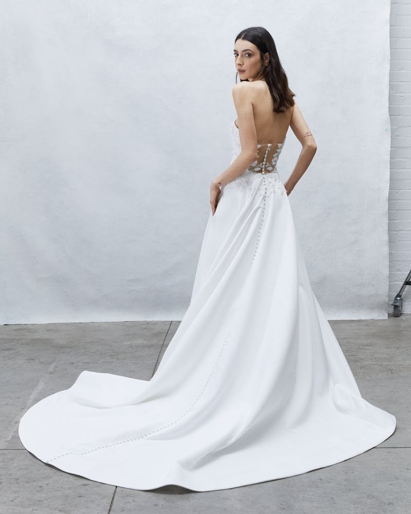 woman wearing Alyne Adeline satin ball gown wedding dress