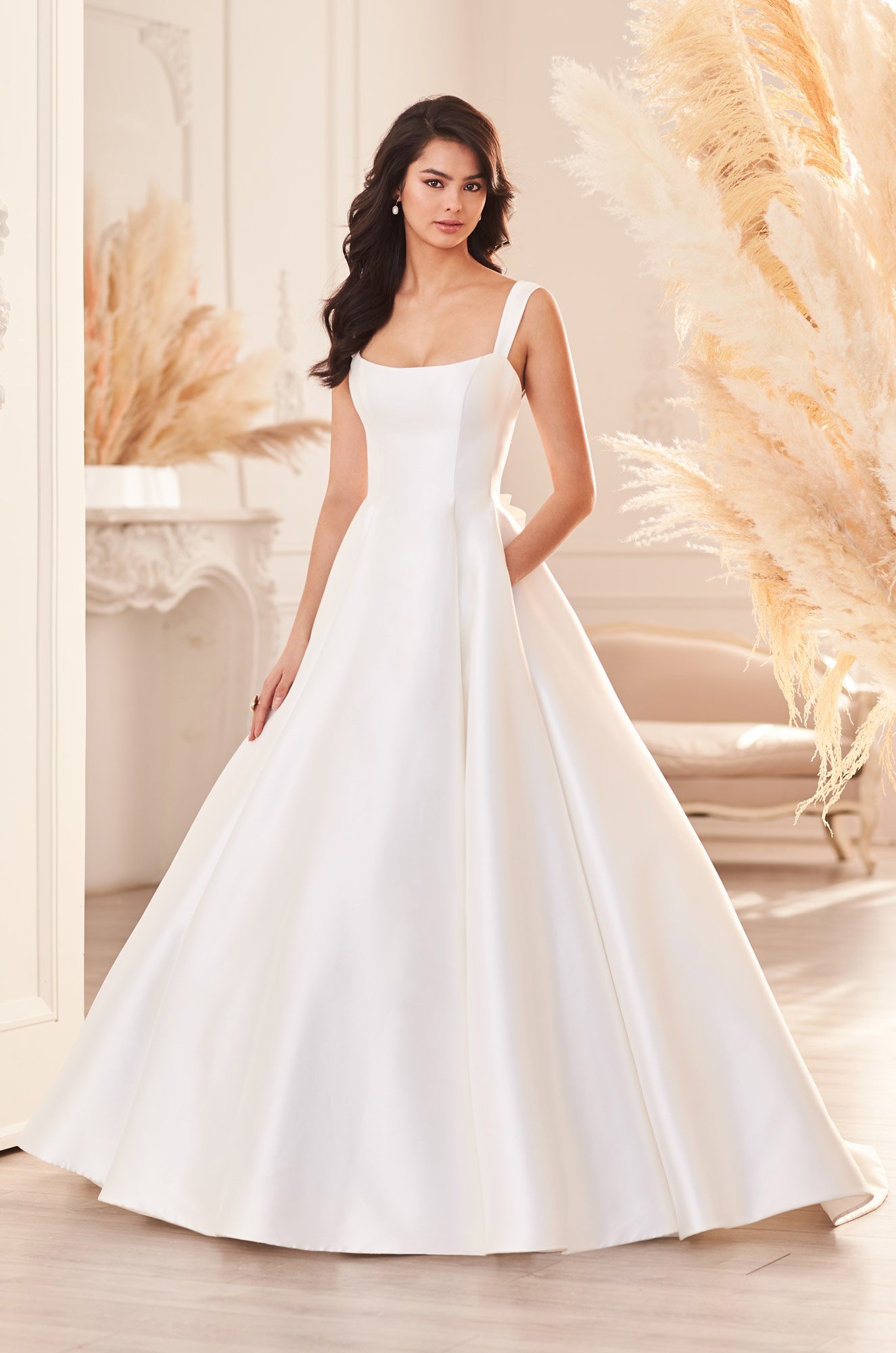 woman wearing Paloma Blanca 4952 ball gown wedding dress