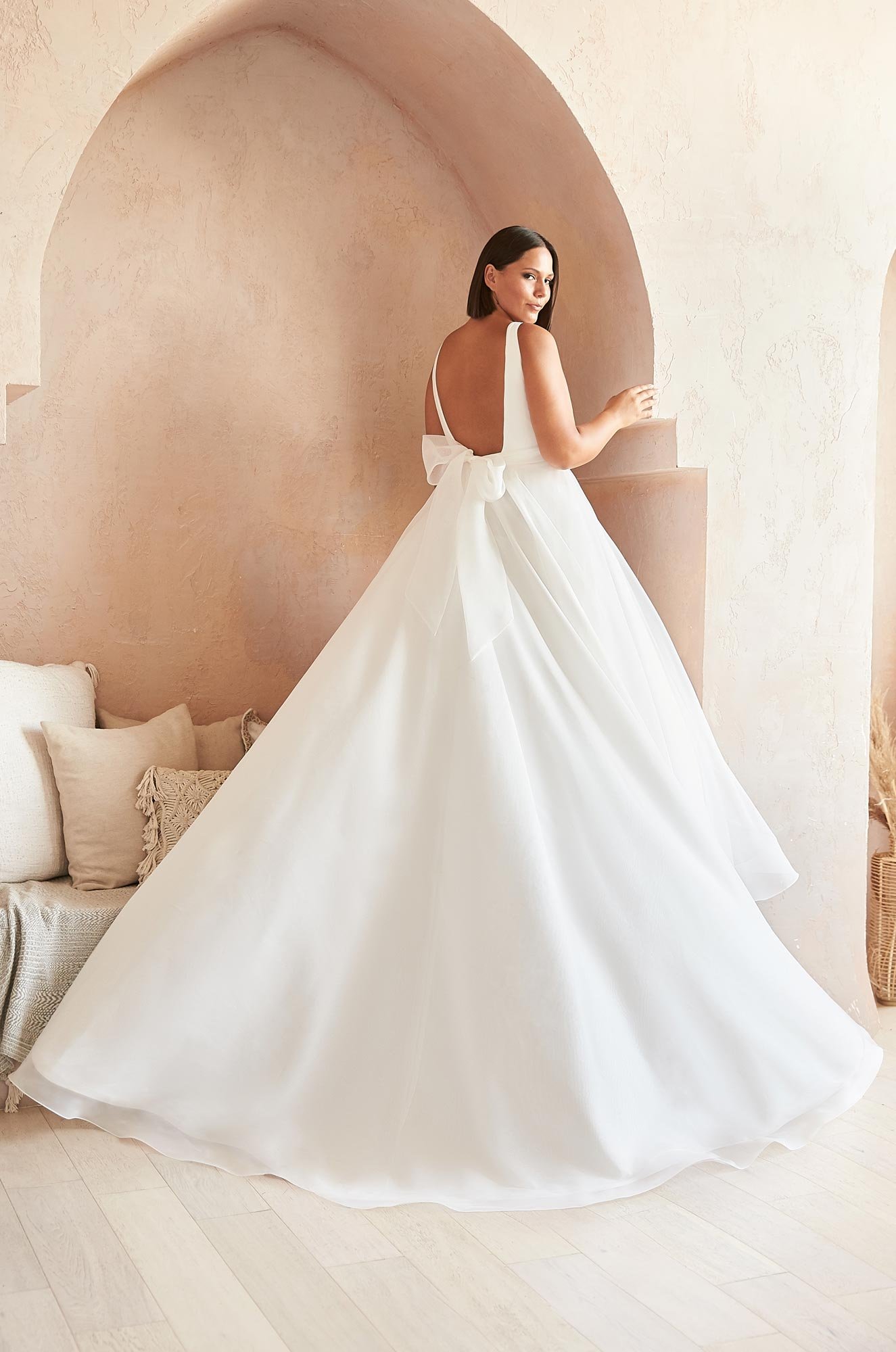 woman wearing Mikaella 2383 crêpe and organza sleeveless wedding dress
