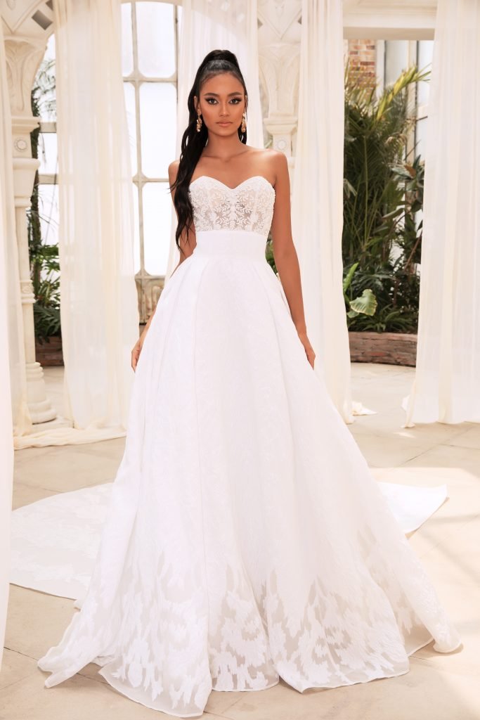 woman wearing Dany Tabet Constantine strapless ball gown exposed corset wedding dress