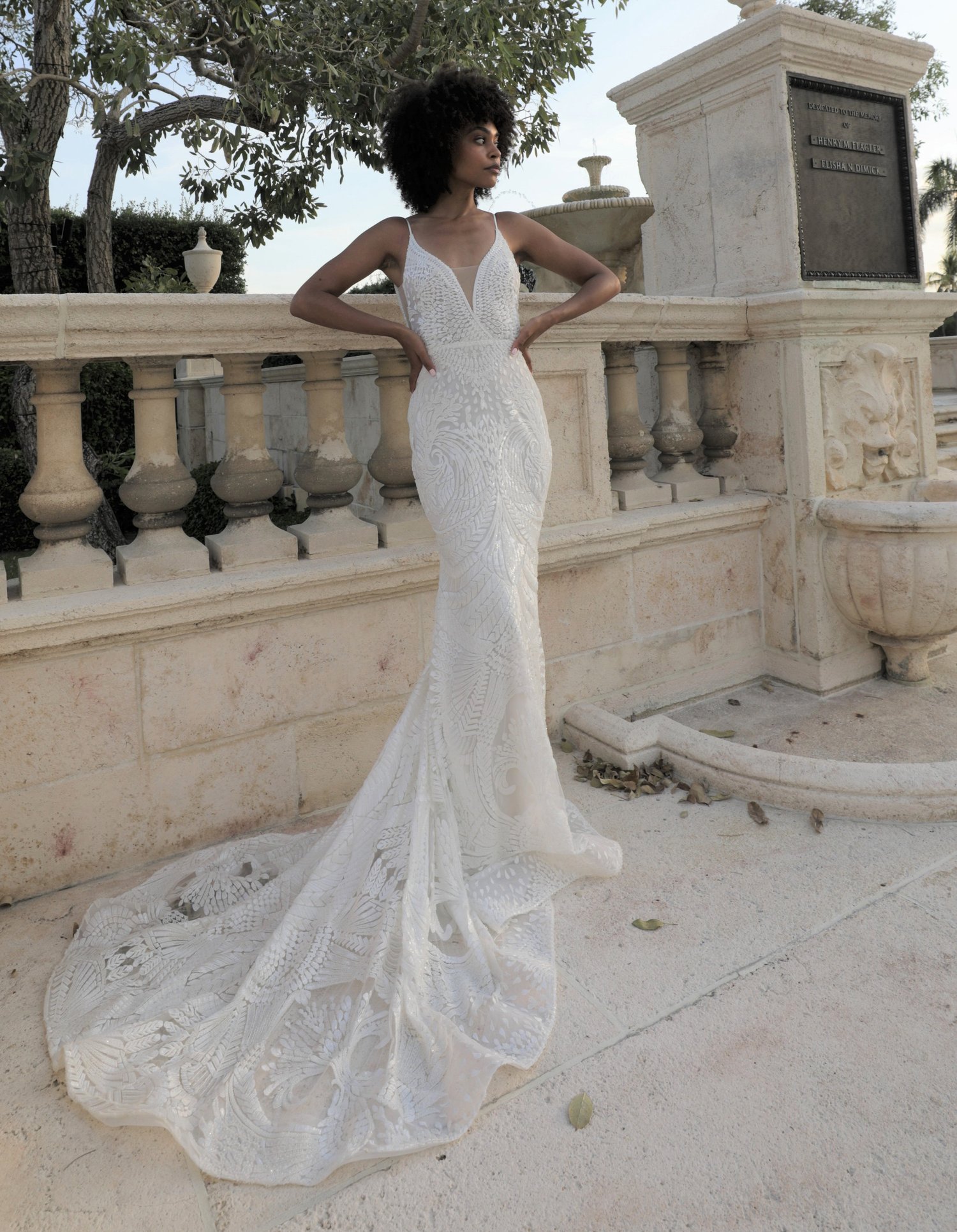 woman wearing Lazaro Rey trumpet wedding dress