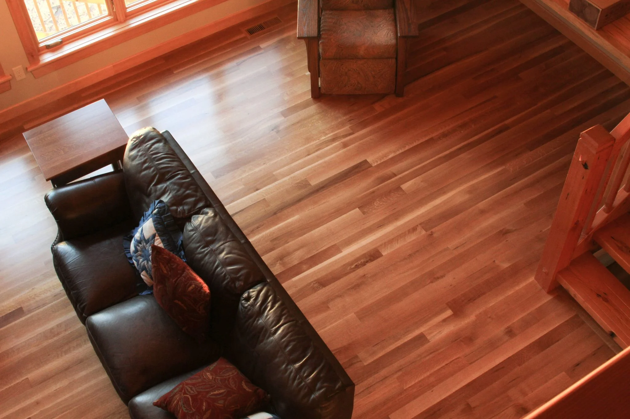 Loft view of rift and quarter sawn white oak hardwood flooring in a timber frame home on Long Lake near Park Rapids, MN.