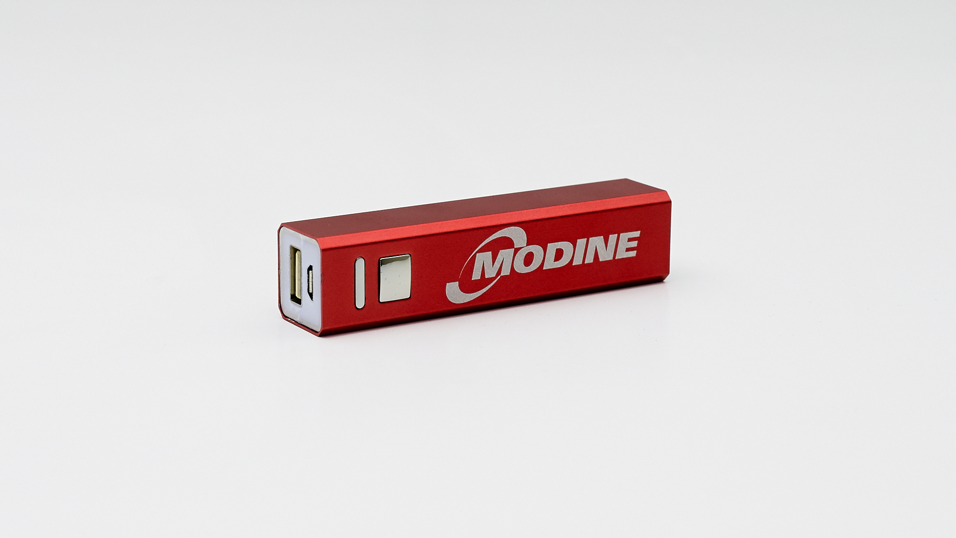 Red USB Power Bank Shot on a White Background in the studio.