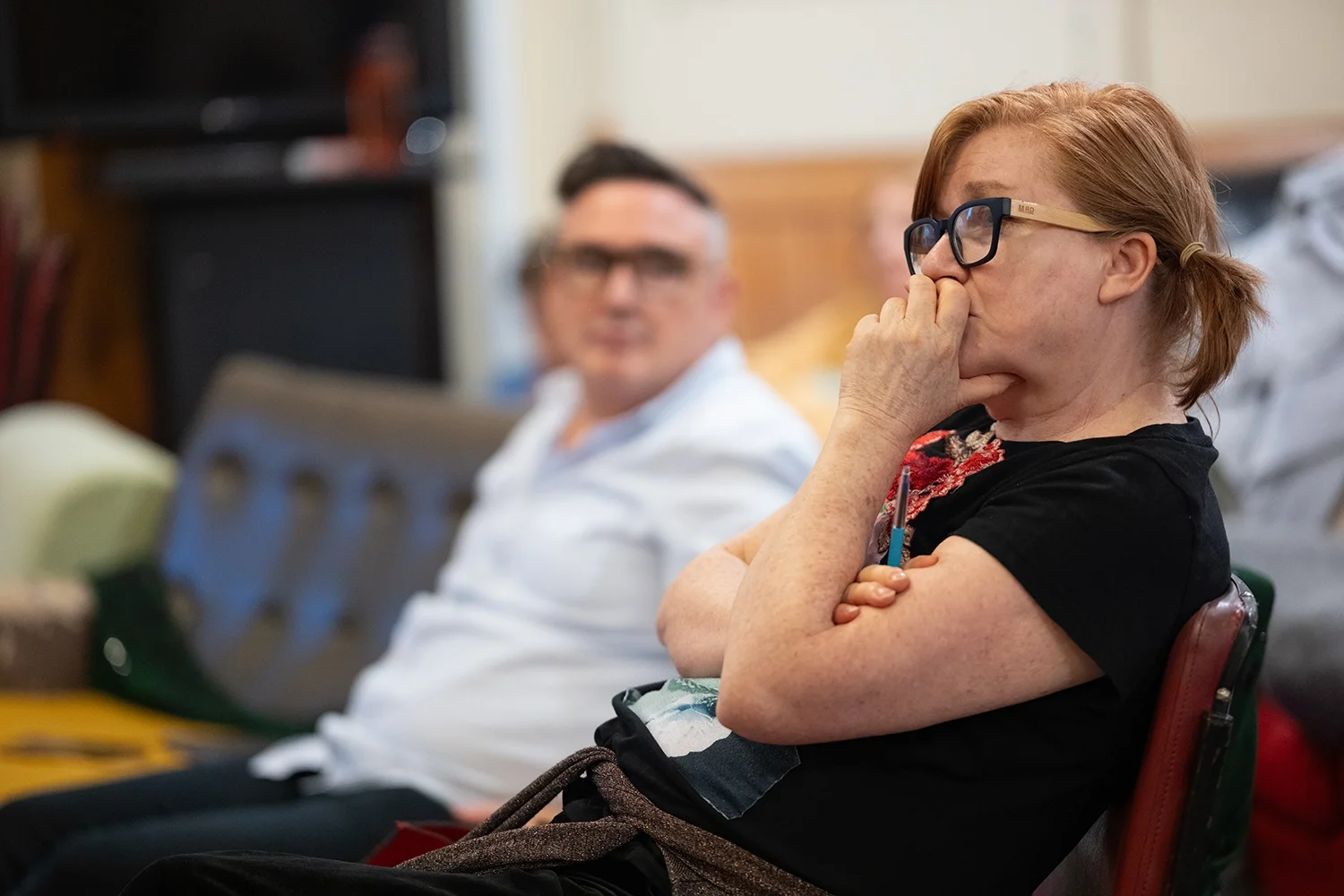 Juliet Furness, an acting coach in Auckland, New Zealand watching student perform a scene and listening intently.