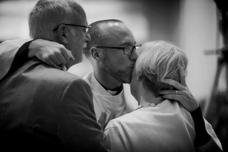 Patrick and parents at ordination ceremonu.jpg